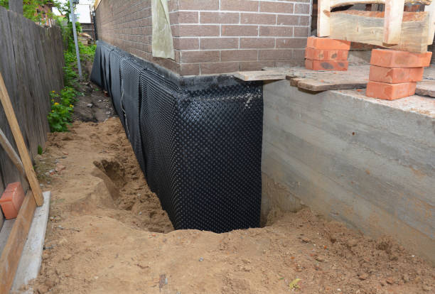 Happy homeowners after waterproofing job in Trinway